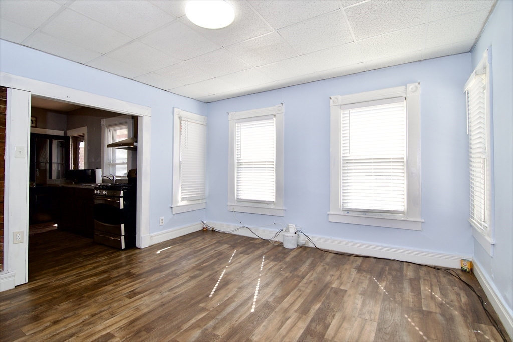 425 Taylor Street, Unit 2 Springfield, MA 01105 - Photo 11 of 28 wooden floor in an empty room with a window