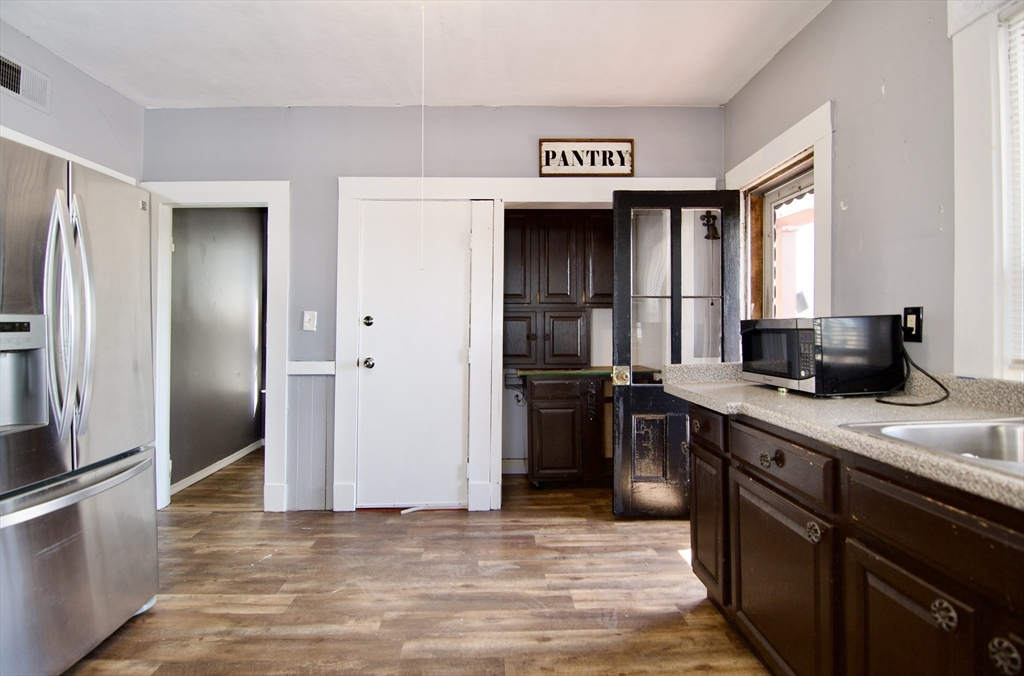425 Taylor Street, Unit 2 Springfield, MA 01105 - Photo 15 of 28 a kitchen with stainless steel appliances granite countertop a refrigerator and a sink