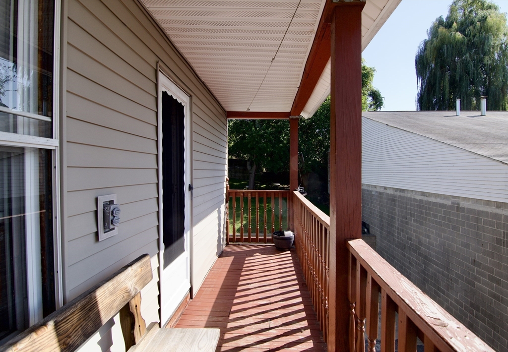 425 Taylor Street, Unit 2 Springfield, MA 01105 - Photo 18 of 28 a view of balcony with wooden floor and fence