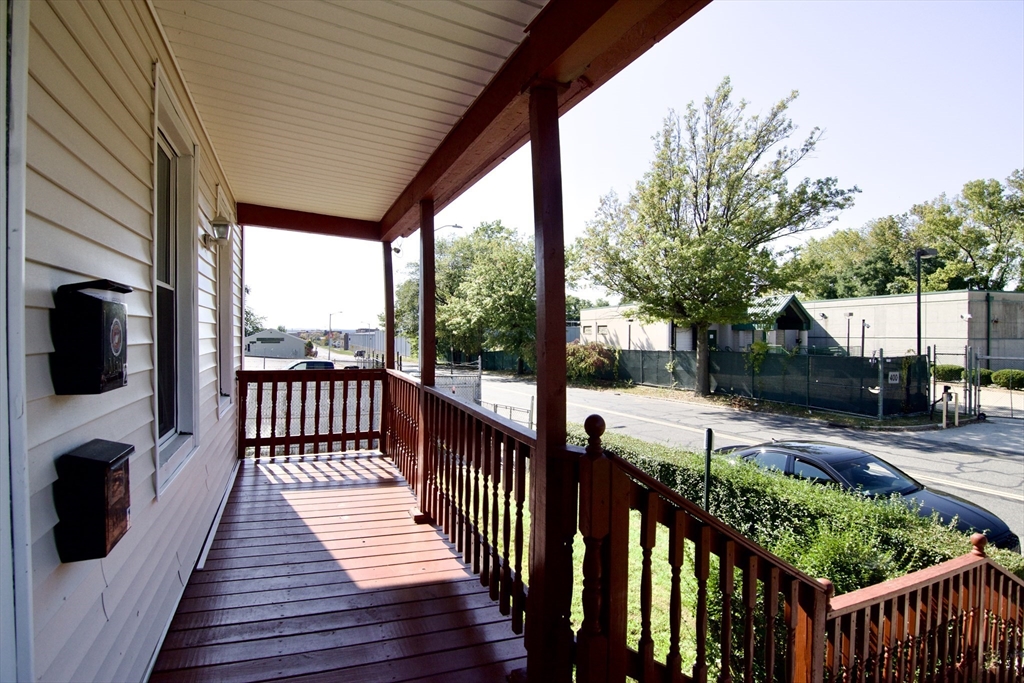 425 Taylor Street, Unit 2 Springfield, MA 01105 - Photo 2 of 28 a view of a porch with wooden floor of a house