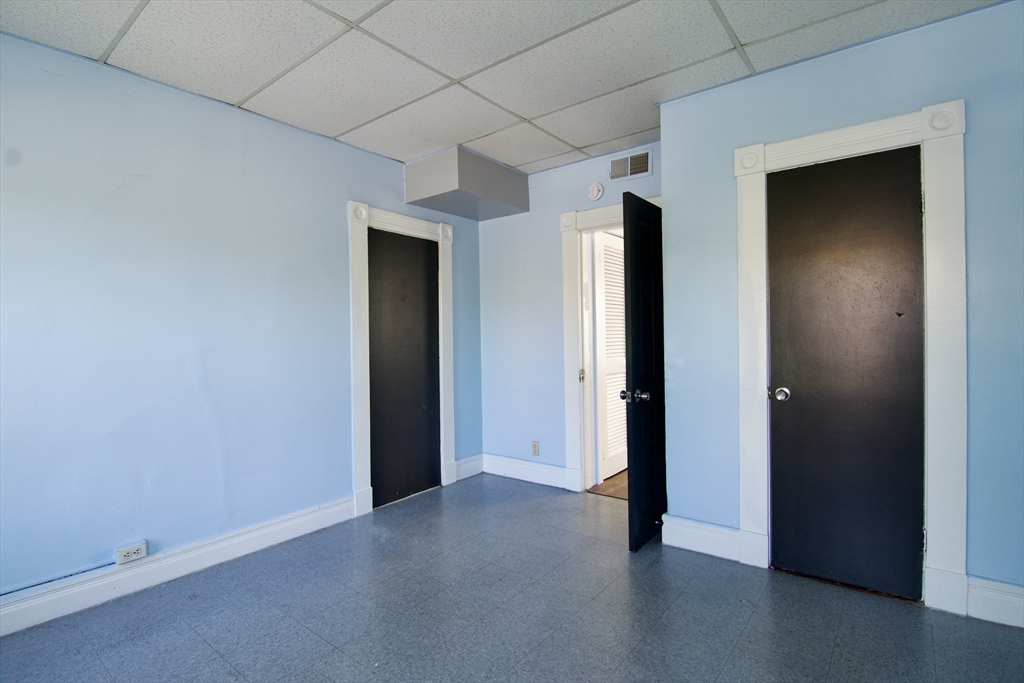 425 Taylor Street, Unit 2 Springfield, MA 01105 - Photo 21 of 28 an empty room with closet and wooden floor