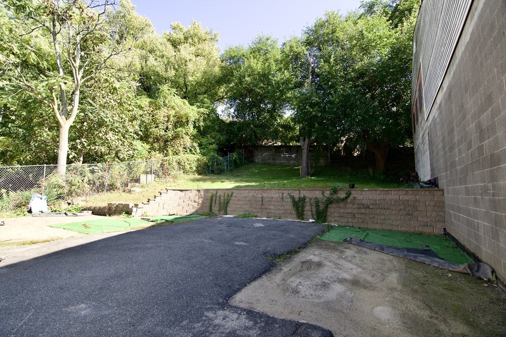 425 Taylor Street, Unit 2 Springfield, MA 01105 - Photo 3 of 28 a view of a backyard with large trees
