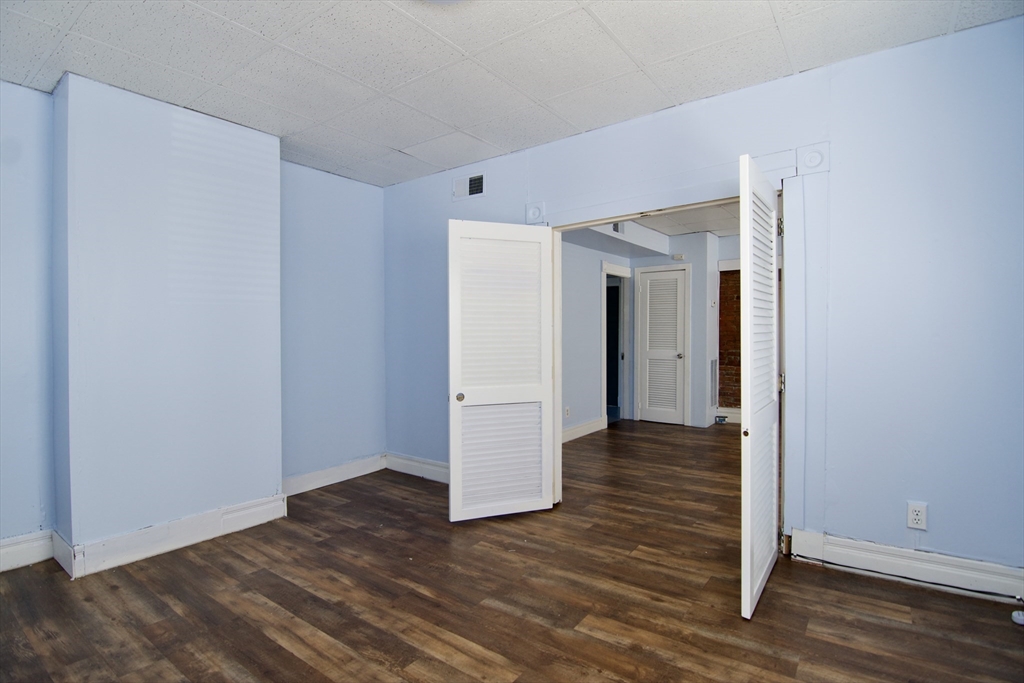 425 Taylor Street, Unit 2 Springfield, MA 01105 - Photo 7 of 28 a view of a hallway with wooden floor
