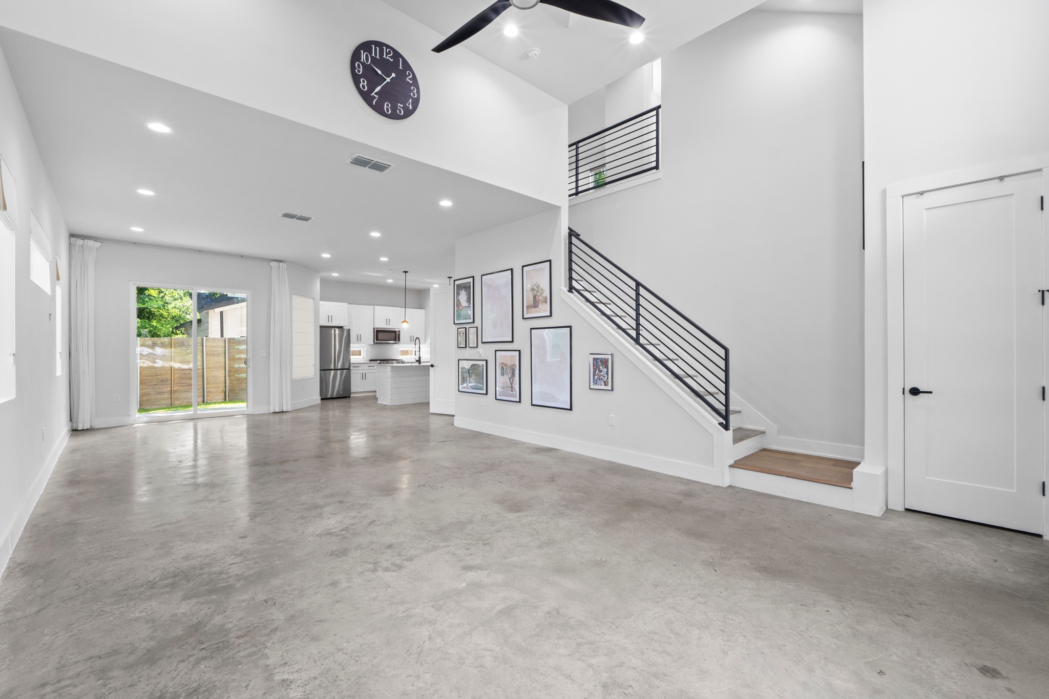 2007 Chestnut Avenue, Unit 1 Austin, TX 78722 - Photo 7 of 32 Lofty ceilings and sleek concrete flooring characterize this open-concept interior.