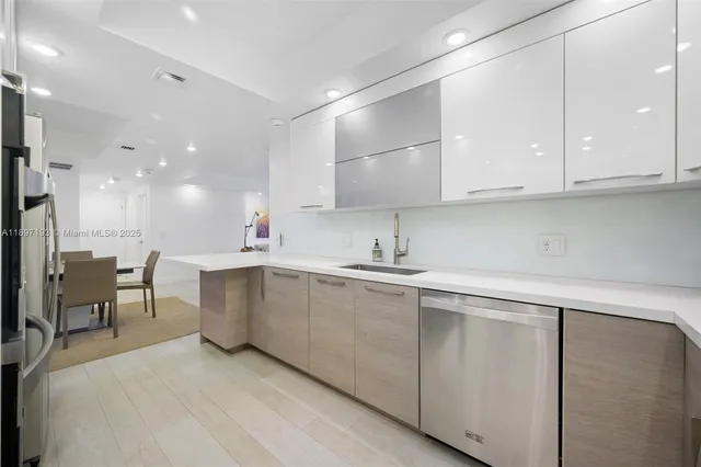 a kitchen with cabinets and sink