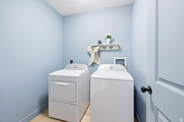 283 North 500 West Mapleton, UT 84664 - Photo 77 of 102 Laundry room featuring a textured ceiling, light wood-style flooring, and washer and dryer.