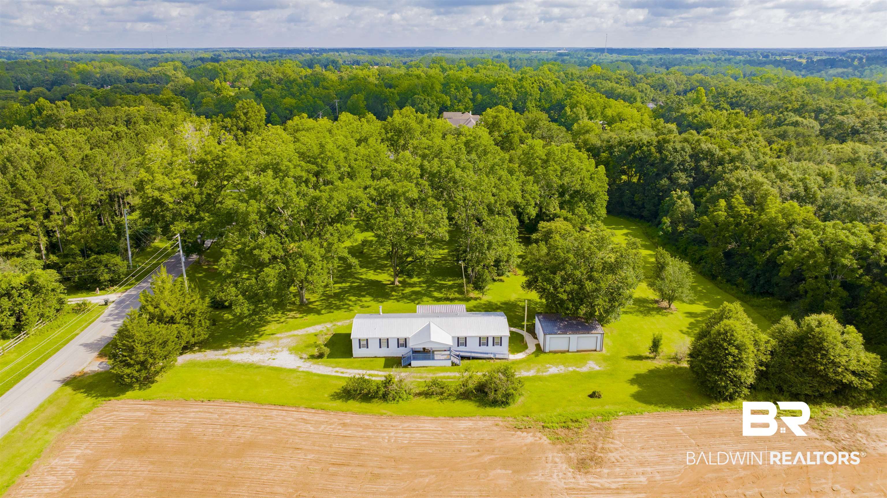 25700 County Road 71 Robertsdale, AL 36567 - Photo 38 of 40 View from above of property with a forest