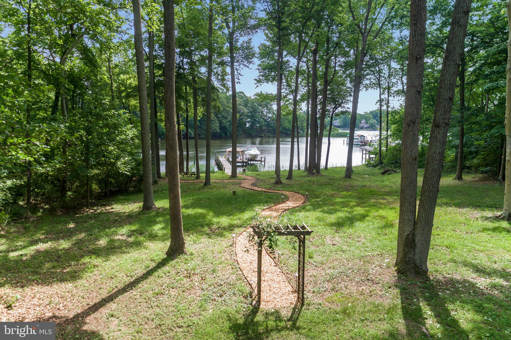 3321 Old Point Road Edgewater, MD 21037 - Photo 2 of 3 a view of a garden with a tree
