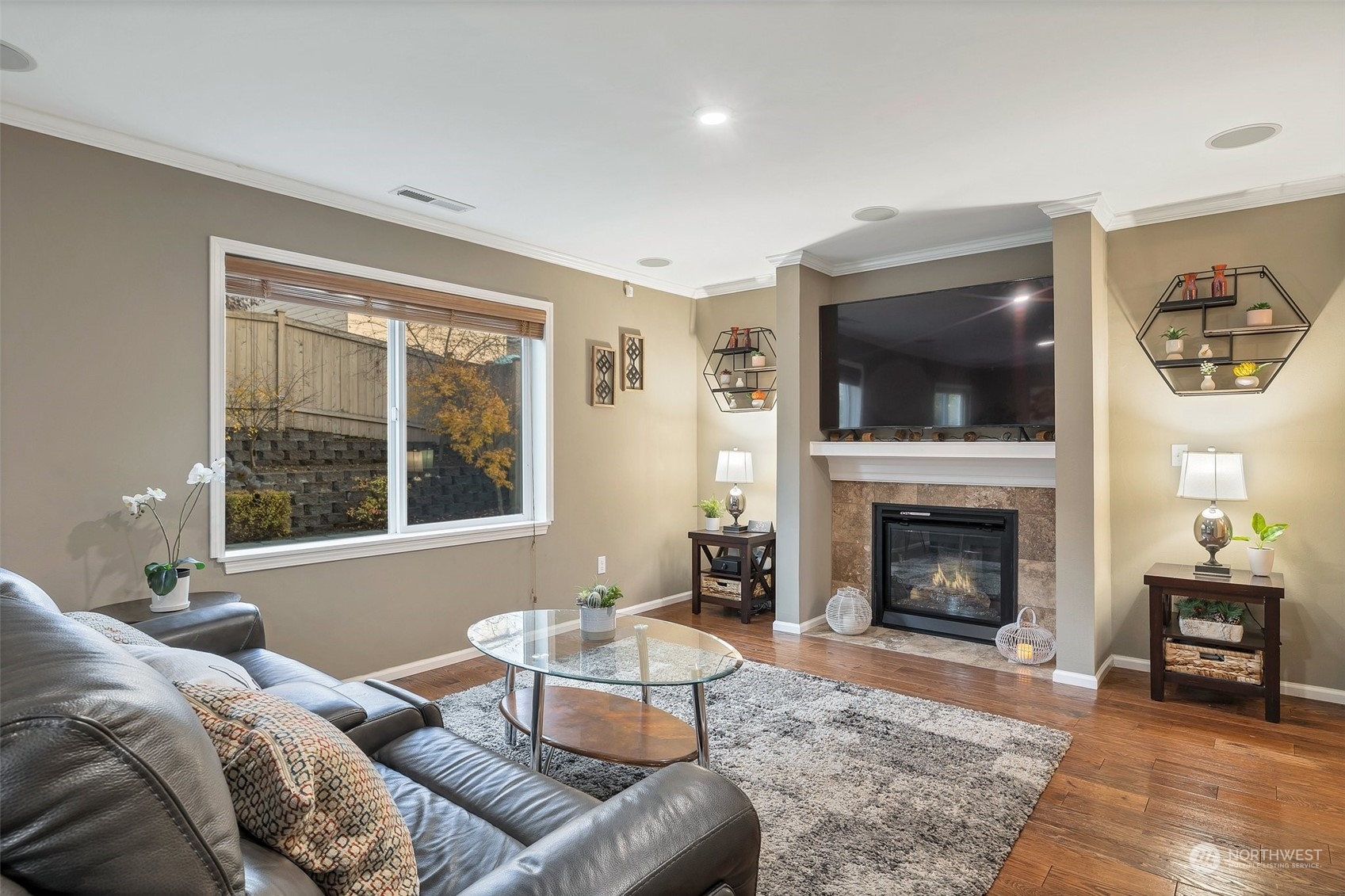 16603 42nd Avenue Southeast Bothell, WA 98012 - Photo 8 of 35 a living room with furniture a flat screen tv and a fireplace