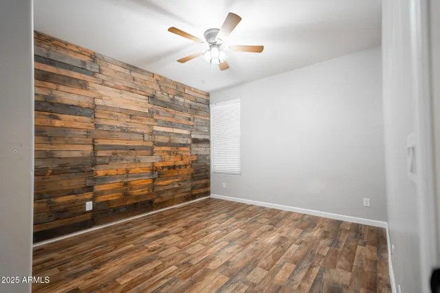 a view of an empty room and a window