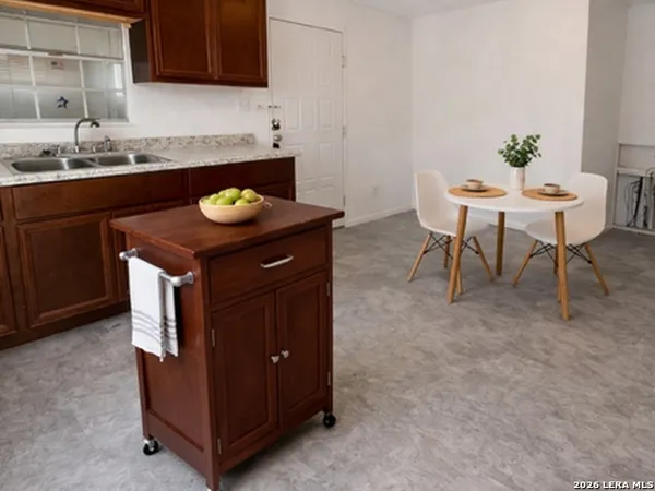 a kitchen with a sink and cabinets