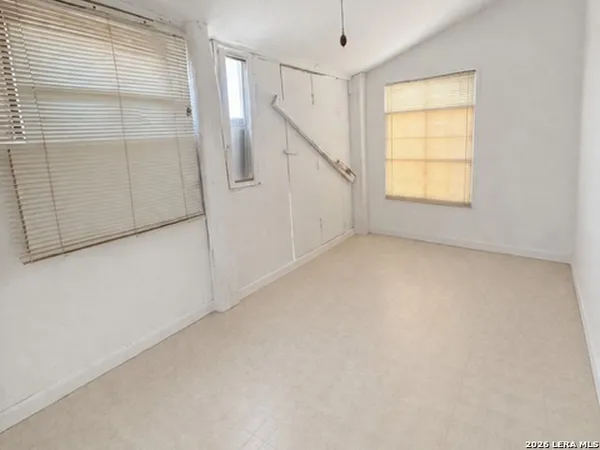 an empty room with windows