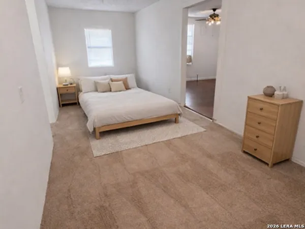 a bedroom with a bed and a dresser