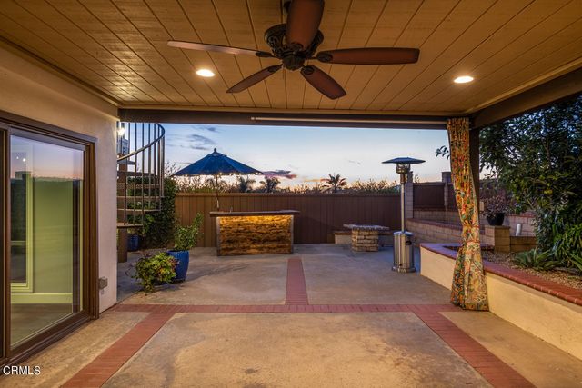 a view of a house with a potted plant