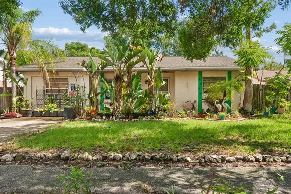 a view of a house with a garden