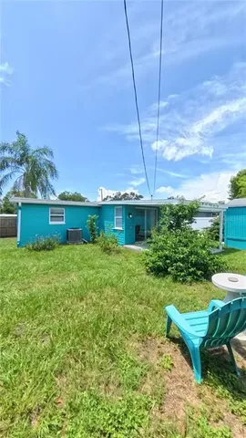 a view of a backyard with plants and a garden