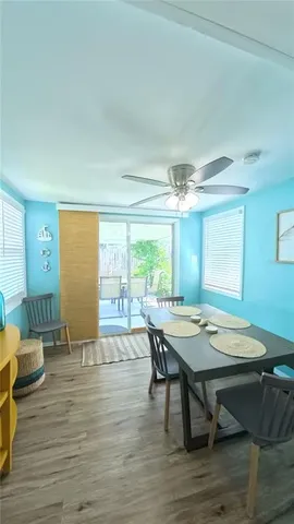 a room with lots of furniture and wooden floor