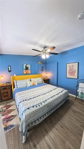 a bedroom with bed and window