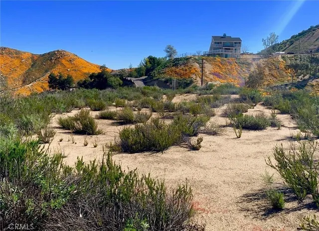 a view of a house with a mountain yard
