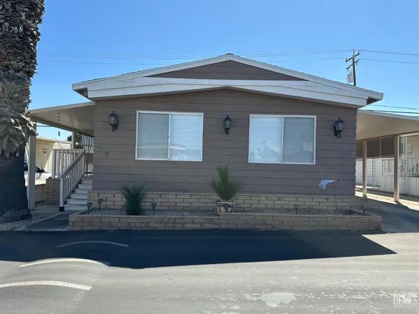 a front view of a house with garage