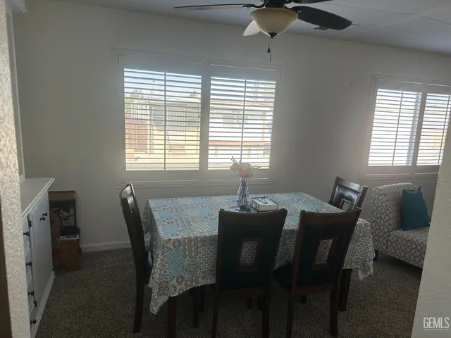 a dining room with furniture and window