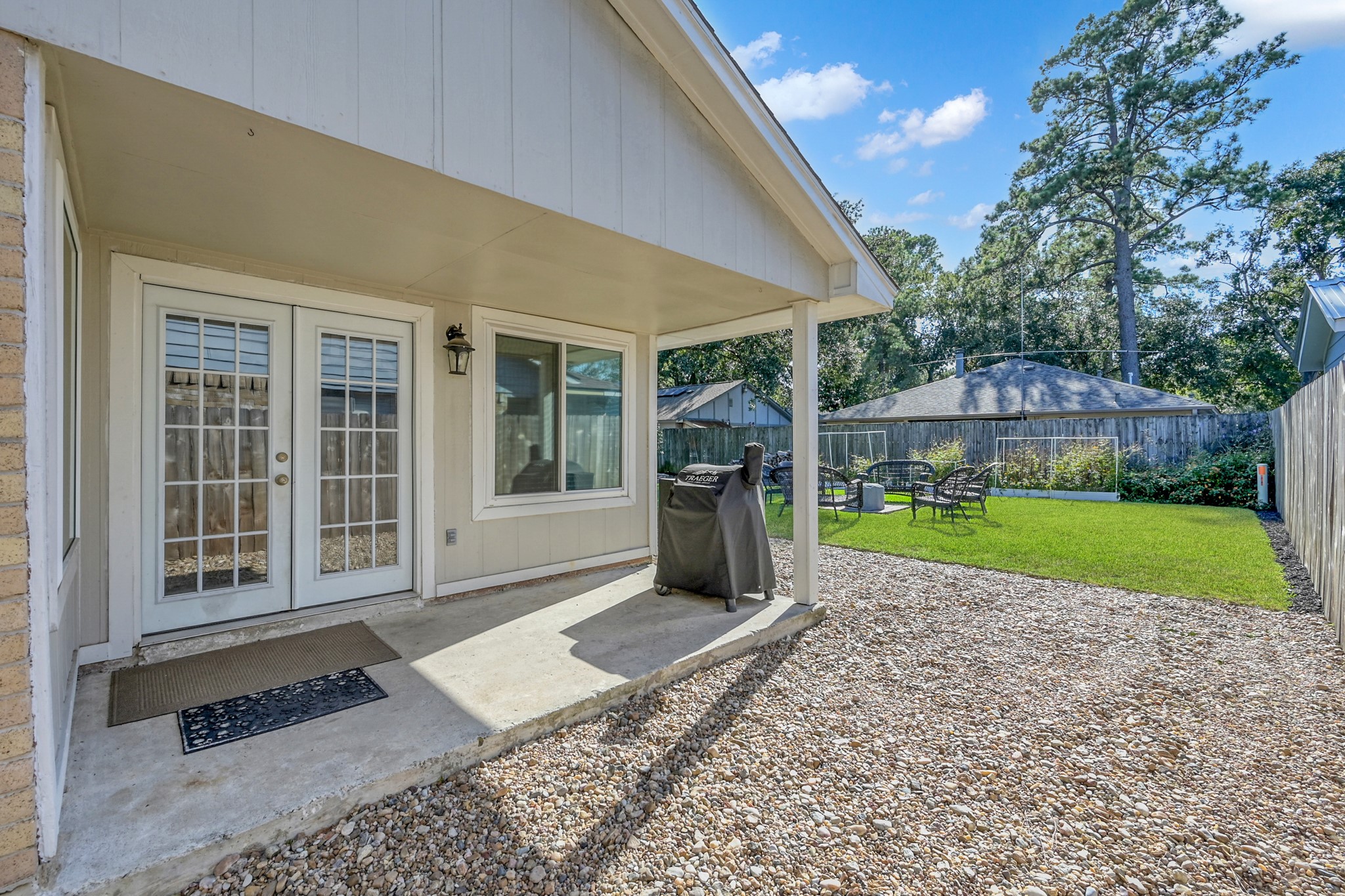 17323 Lowick Street Spring, TX 77379 - Photo 14 of 21 Covered patio for entertaining or enjoying a rainy day.