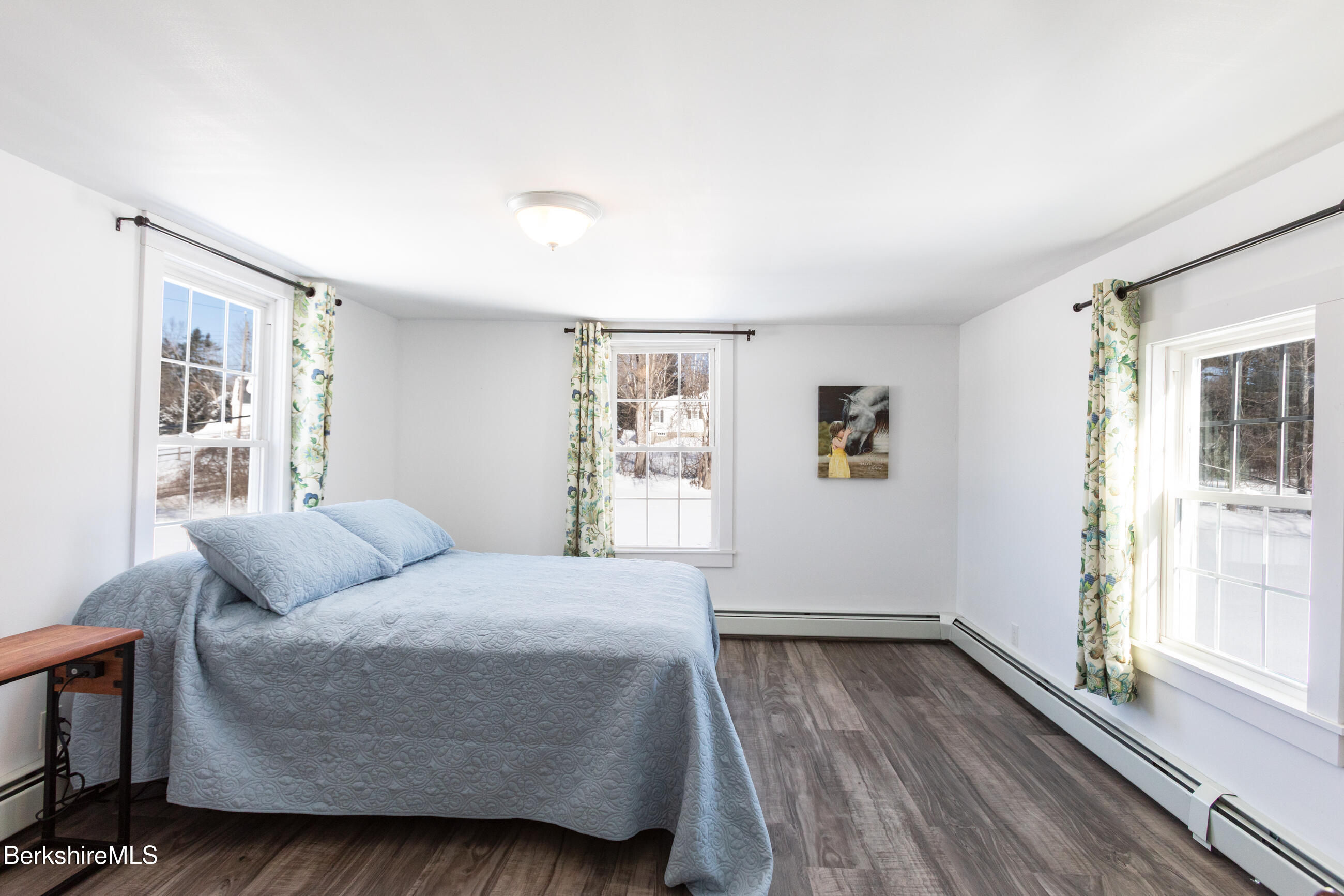 35 Chapman Road Pittsfield, MA 01201 - Photo 23 of 43 a bedroom with a bed and wooden floor