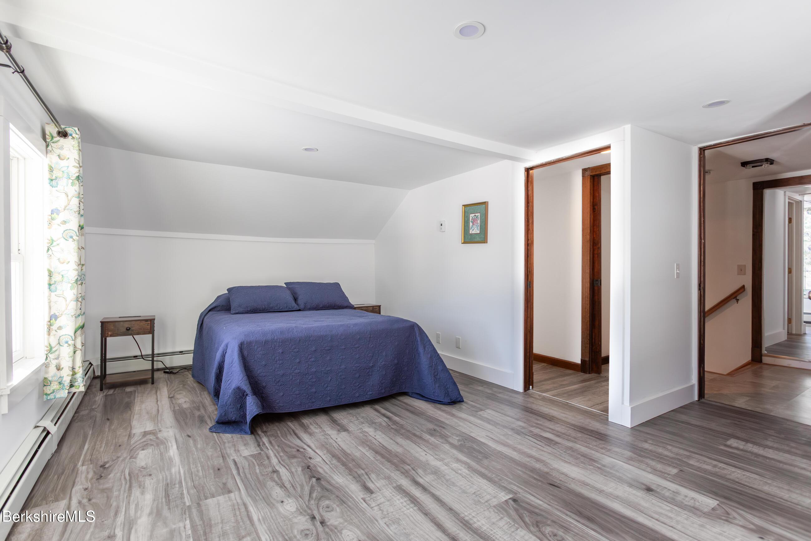 35 Chapman Road Pittsfield, MA 01201 - Photo 26 of 43 a living room with a bed furniture and a wooden floor
