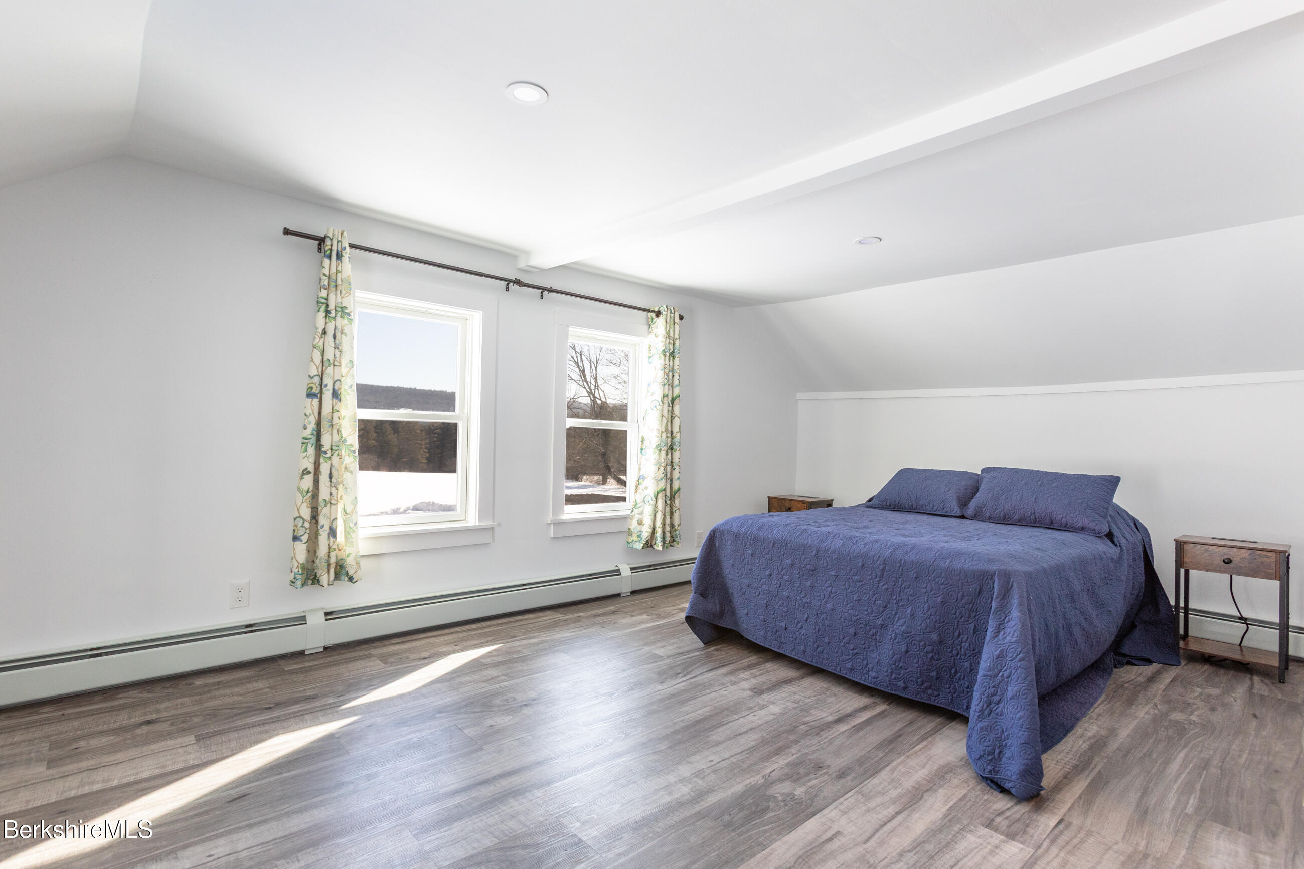 35 Chapman Road Pittsfield, MA 01201 - Photo 28 of 43 a spacious bedroom with a bed and wooden floor