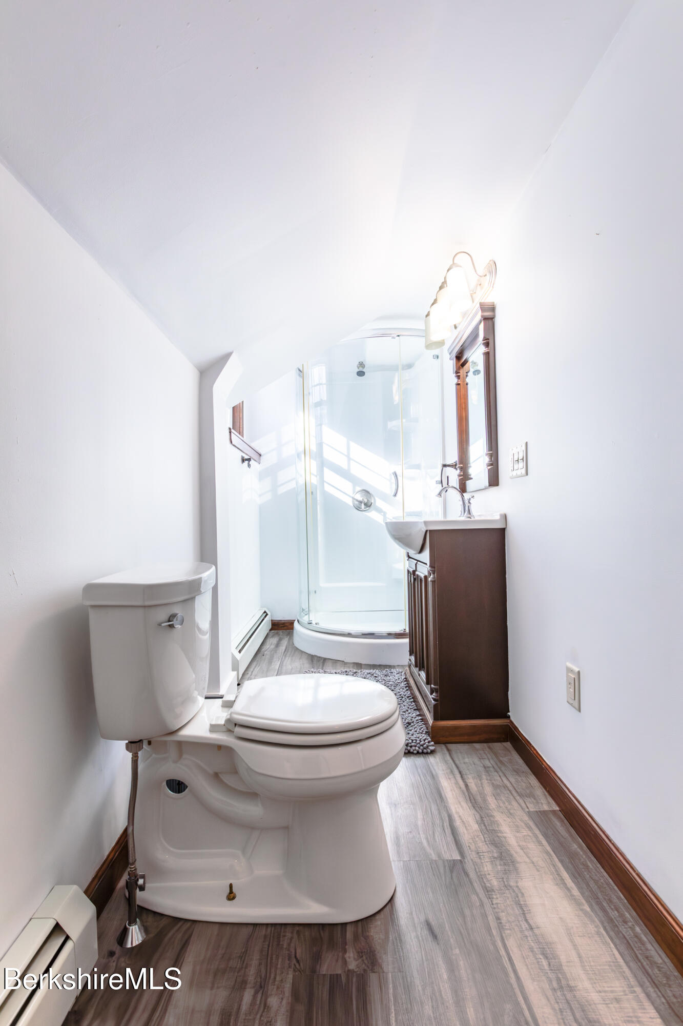 35 Chapman Road Pittsfield, MA 01201 - Photo 30 of 43 a white toilet sitting next to a bathroom sink and tub