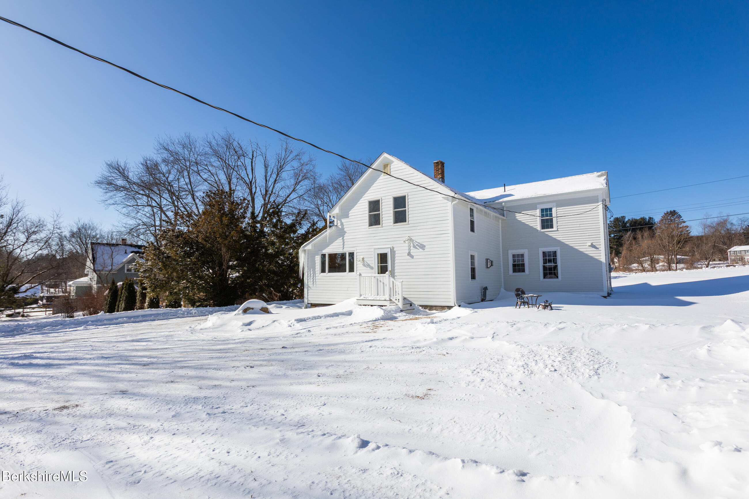 35 Chapman Road Pittsfield, MA 01201 - Photo 38 of 43 a view of a house with a snow in the yard