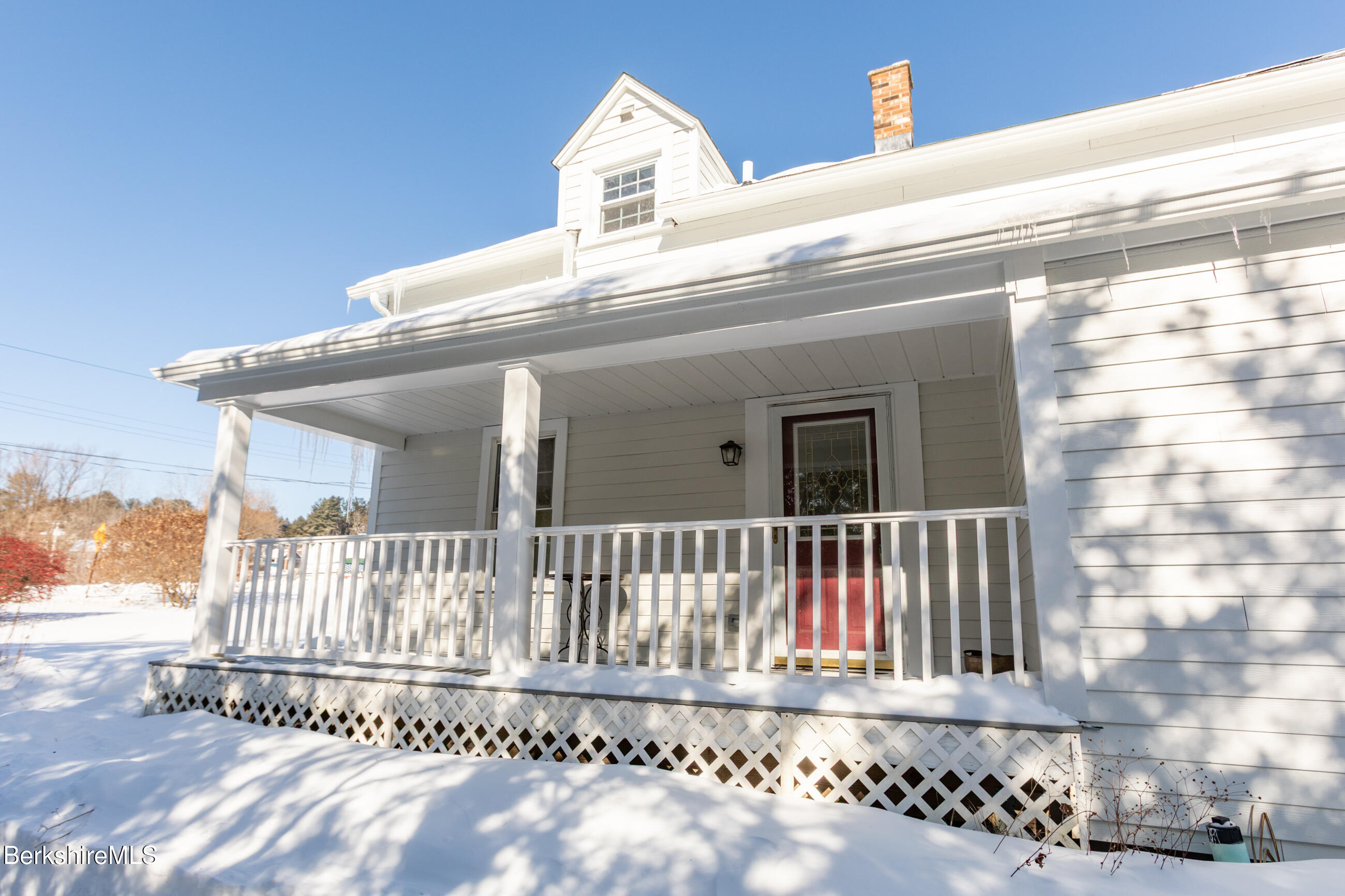 35 Chapman Road Pittsfield, MA 01201 - Photo 43 of 43 a view of a white house with a small yard