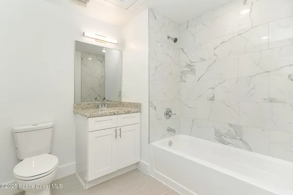 a bathroom with a sink a toilet and a bathtub