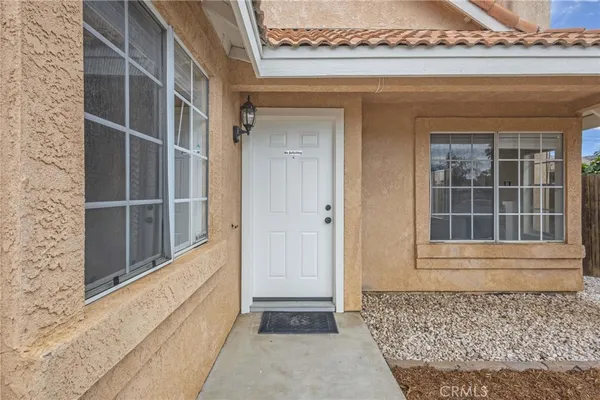 a view of a door and a window