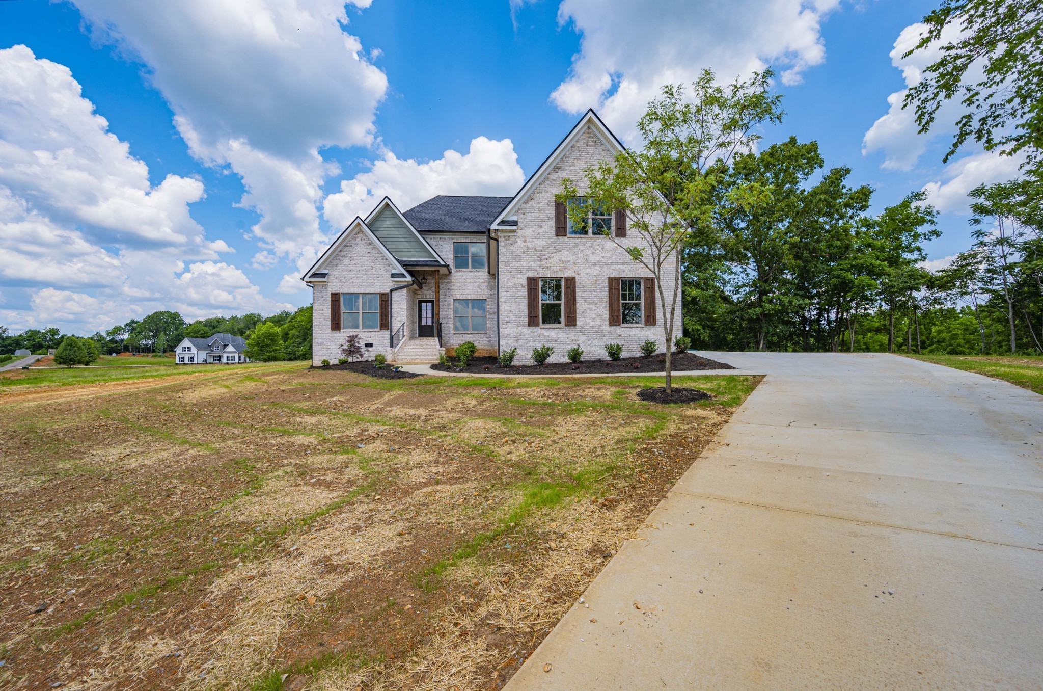 7502 Midland Road Christiana, TN 37037 - Photo 2 of 63 a front view of a house with a yard