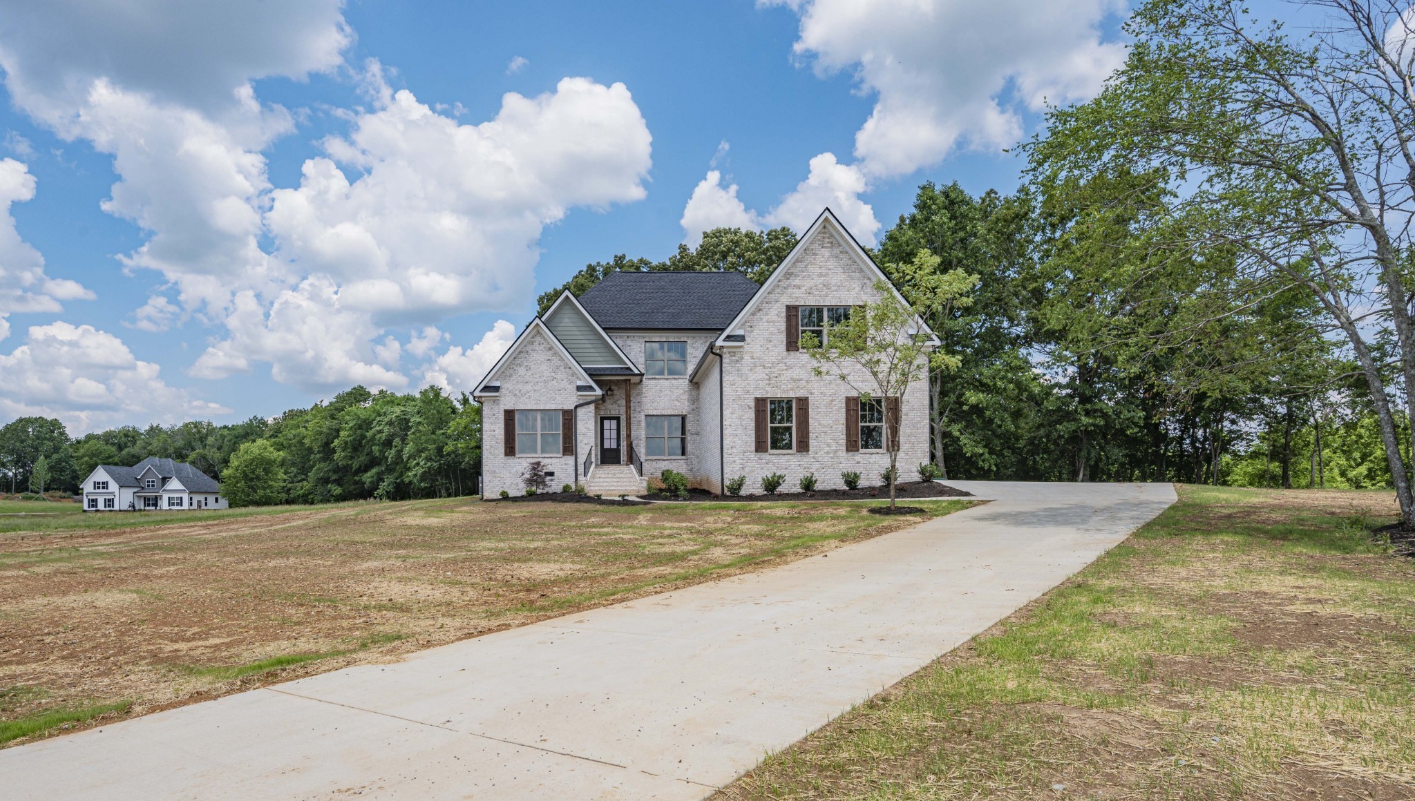 7502 Midland Road Christiana, TN 37037 - Photo 3 of 63 a view of a house with a yard and large trees