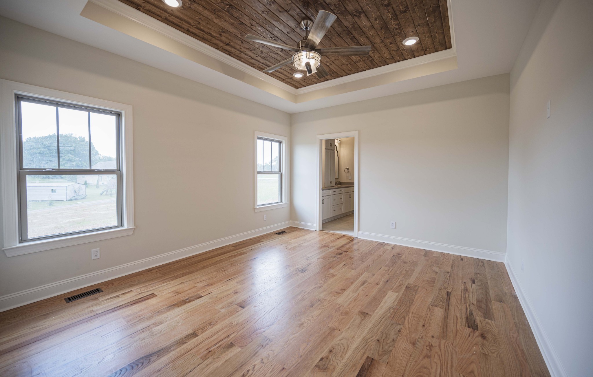 7502 Midland Road Christiana, TN 37037 - Photo 44 of 63 a view of an empty room with wooden floor and a window