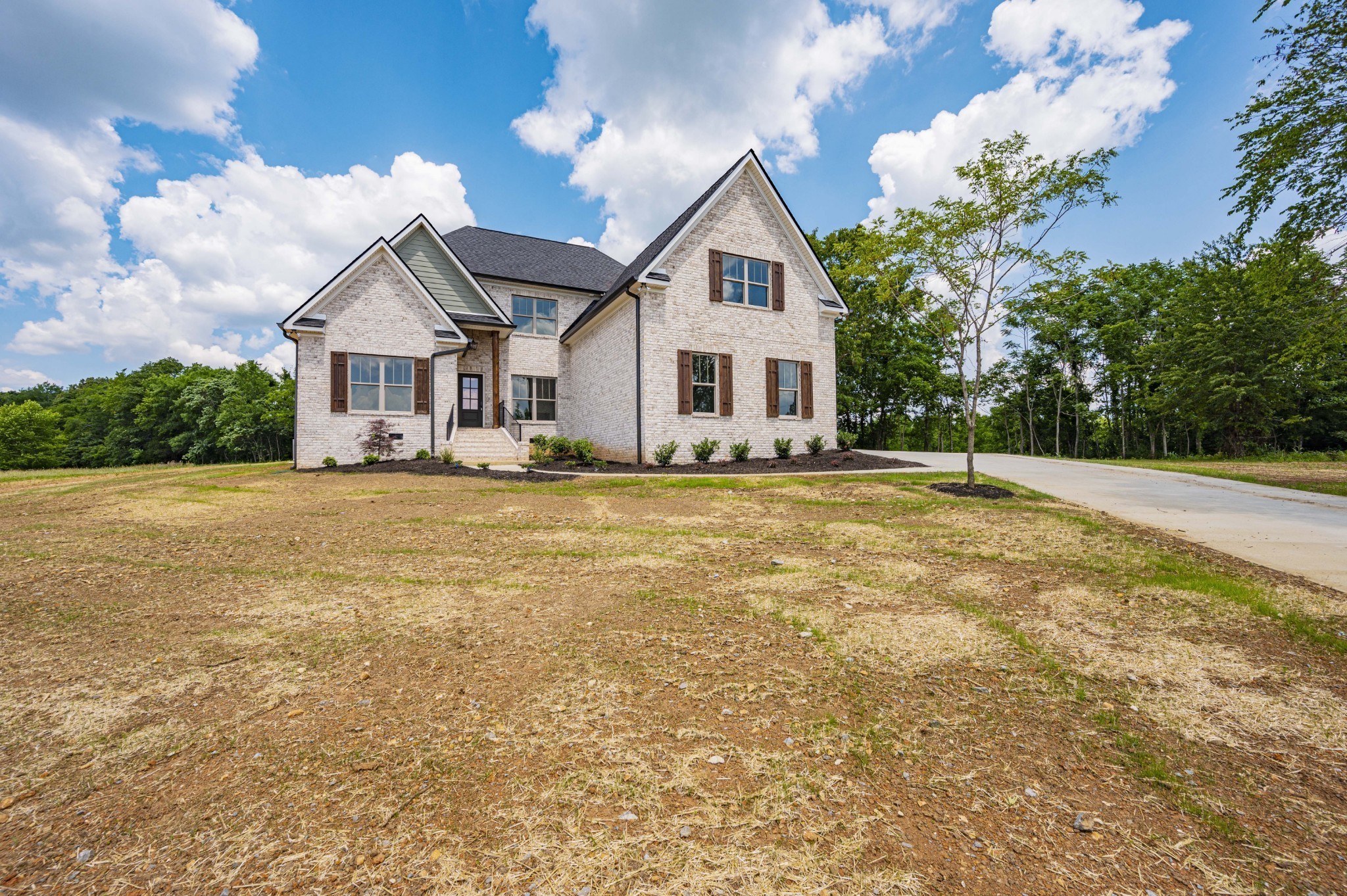 7502 Midland Road Christiana, TN 37037 - Photo 6 of 63 a front view of a house with a yard