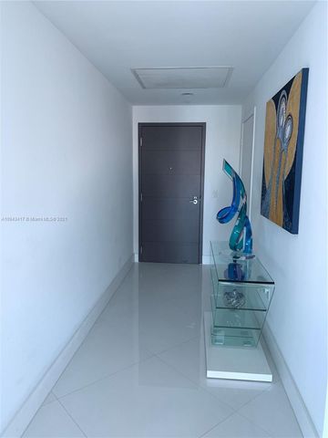 a spacious bathroom with a double vanity sink a mirror and a shower