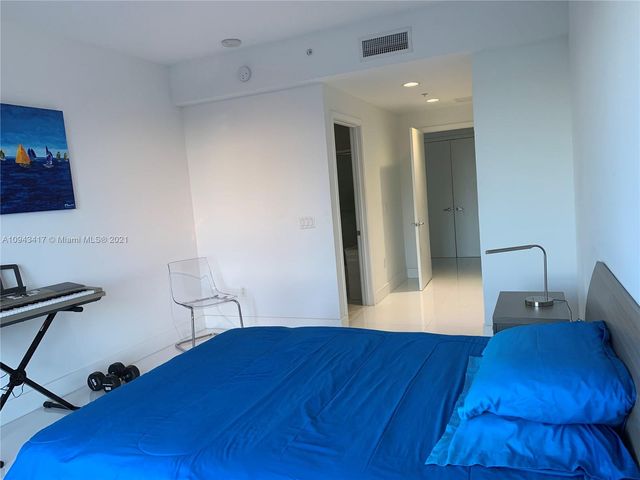 a bathroom with a sink double vanity and a mirror