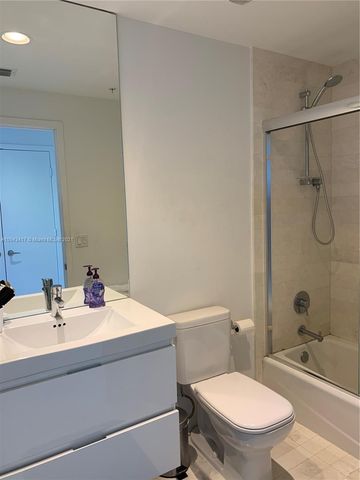 a bathroom with a shower and a bathtub