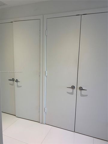 a lobby with furniture and a mirror