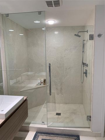 a living room with furniture a flat screen tv and a window