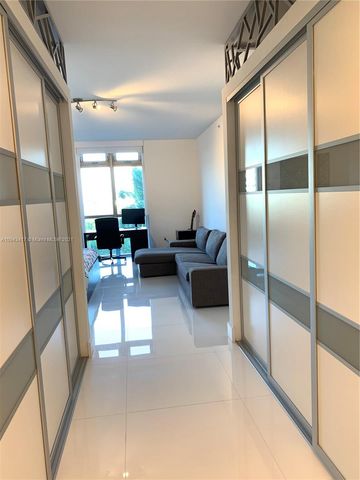 a kitchen with sink and cabinets