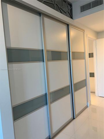 a living room with furniture and flat screen tv