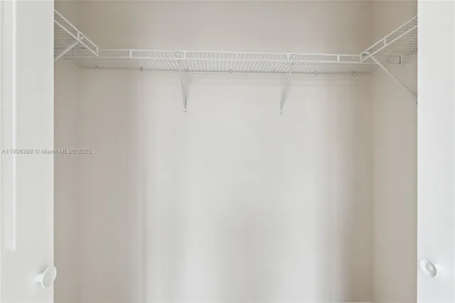 a view of a room with shelf on the wall