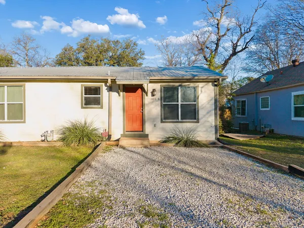 a house view with a backyard space