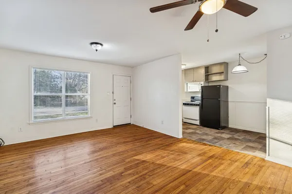 a view of an empty room with a window