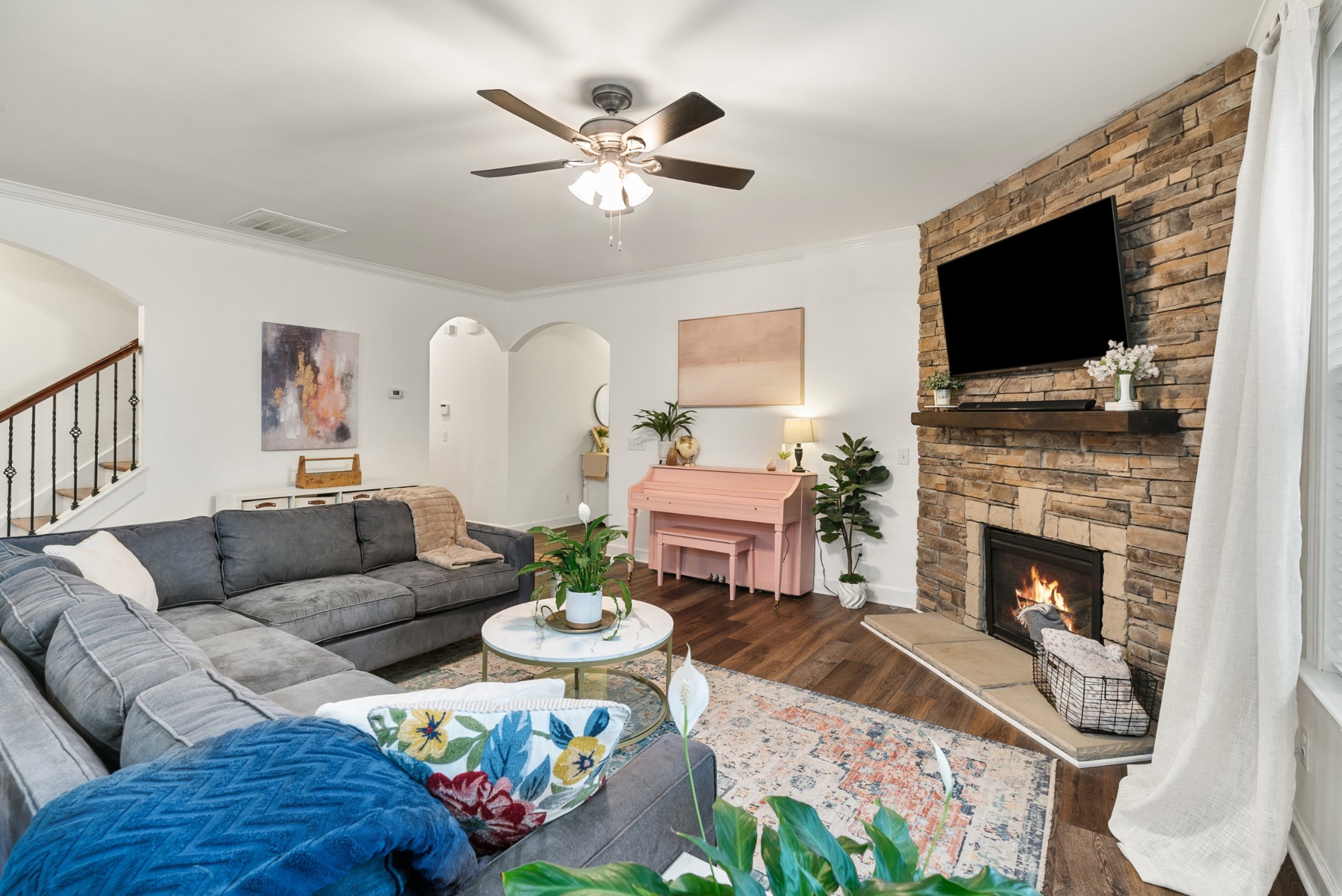 2014 Morton Drive Spring Hill, TN 37174 - Photo 11 of 44 a living room with furniture a flat screen tv and a fireplace