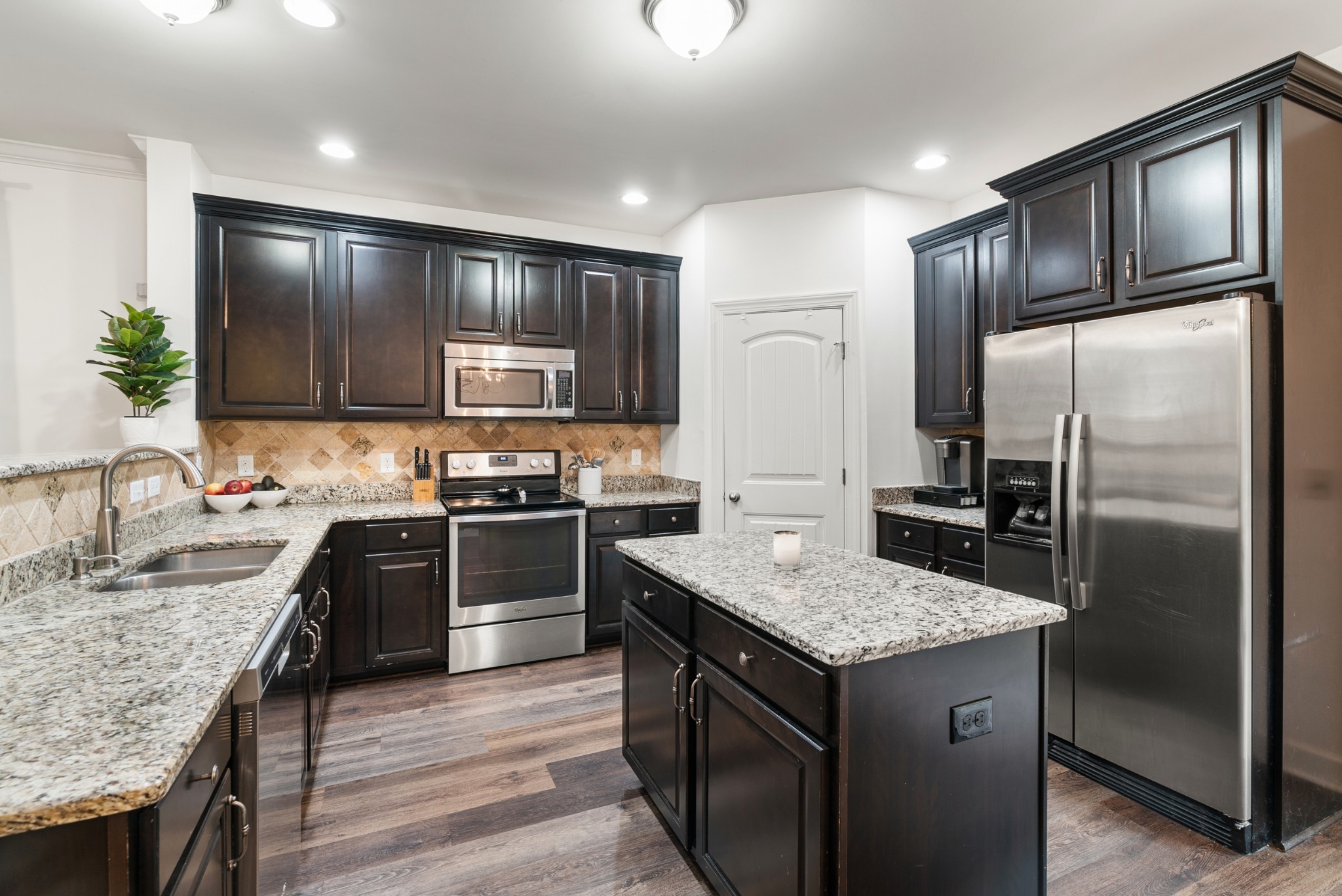 2014 Morton Drive Spring Hill, TN 37174 - Photo 18 of 44 a kitchen with a refrigerator sink and cabinets